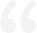 Large, light gray opening quotation mark symbol on a black background.